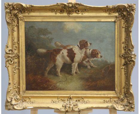ENGLISH SCHOOL (19TH CENTURY), TWO SPANIELS IN A LANDSCAPE, initialled 'J.S' lower left, oil on canvas laid on board, in a gi