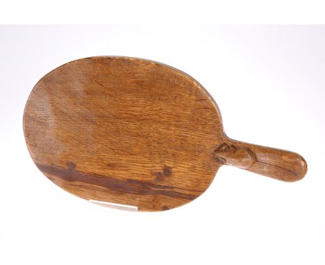 ROBERT THOMPSON OF KILBURNA MOUSEMAN OAK CHEESEBOARD, the adzed oval board with darker grains, carved mouse signature to the 