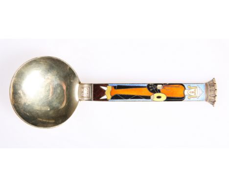 A NORWEGIAN STERLING SILVER-GILT AND ENAMEL SPOON, by J. Tostrup, enamelled with the figure of an archer, signed. 14.2cm