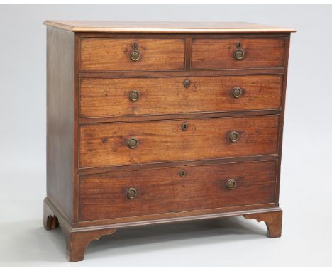 A GEORGE III MAHOGANY CHEST OF DRAWERS, the moulded rectangular top above two short over three long graduated drawers each fi