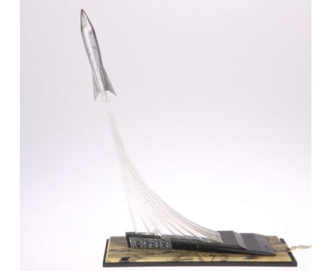 A MID-CENTURY USSR RUSSIAN "MONUMENT TO THE CONQUERORS OF SPACE" TABLE LAMP, of clear and coloured plastic, depicting a rocke