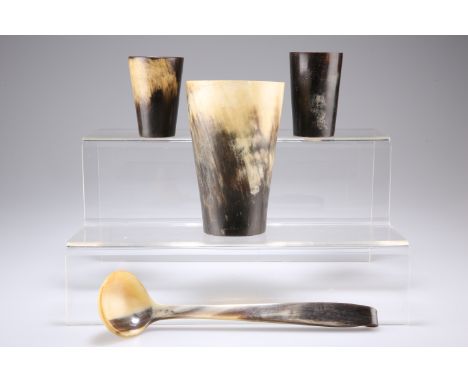 A GROUP OF SCOTTISH HORN ITEMS, comprising three beakers and a ladle. (4)