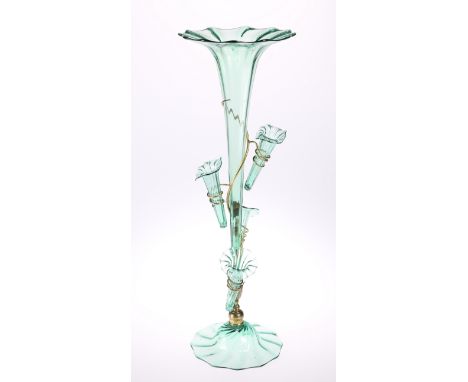 A VICTORIAN GREEN GLASS EPERGNE, the central trumpet-shaped vase surrounded by four small conforming vases, issuing from a do