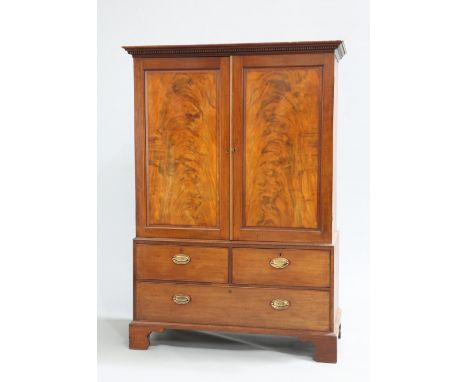 A GEORGE III MAHOGANY PRESS, with dentil moulded cornice over a pair of fielded panel doors, the base with two short over one