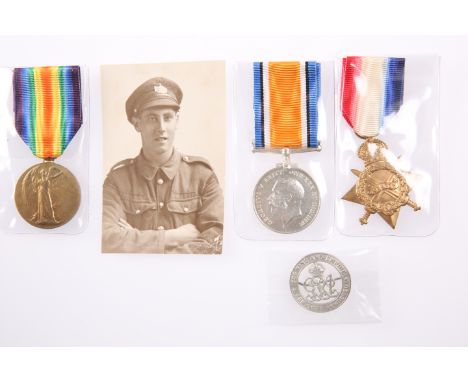 A WWI MEDAL TRIO, SERVICE BADGE AND PHOTOGRAPH, 10075 G. Halford GLOUC. R., badge no. 223346.&nbsp;