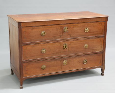 A GEORGE III MAHOGANY COMMODE, CIRCA 1805, the moulded rectangular top above three long drawers, each with brass backplate ha