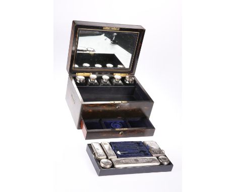 A 19TH CENTURY COROMANDEL LADY'S DRESSING BOX, the interior with mirror and an assortment of silver-plate topped jars and bot