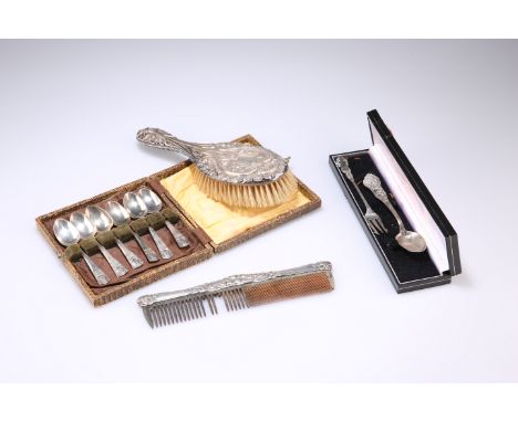 AN ART NOUVEAU SILVER BACKED HAIR BRUSH, by William Devenport, Birmingham 1906, embossed with green man mask and foliate scro