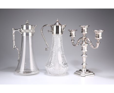 TWO SILVER-PLATE MOUNTED CLARET JUGS, the first with bamboo-form handle, the second with mask-spout; together with AN ITALIAN