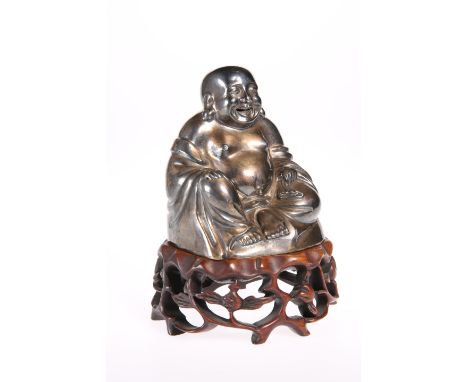 A FINE CHINESE SILVER BUDDHA, signed, the hollow figure modelled sitting with smiling expression, the interior gilded, raised