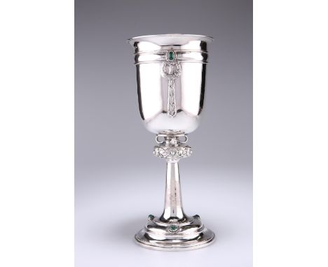 A GEORGE V SILVER ALWYN CARR CHALICE, London 1927, the flared chalice bowl embellished with inset green gem-set stones above 
