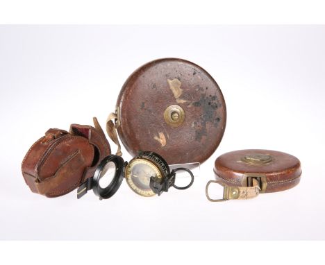 ~ A DOLLOND NO. 701 IMP. MKII BRASS BODIES OFFICER'S MARCHING COMPASS, complete with fitted leather case; together with TWO C