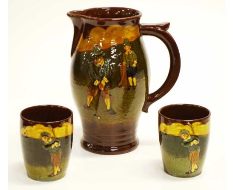 Royal Doulton golfing Kingsware jug &amp; two beakers C1920's,decorated in low relief golfer &amp; his caddy, after designs b