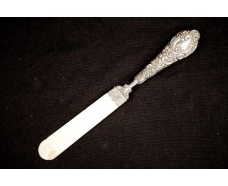 Antique sterling silver and ivory paper turner hallmarked Birmingham 1901, length 24cm approx. NB. This item may not be expor