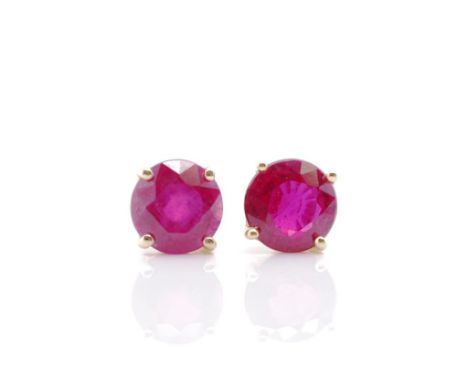 Ruby set 10ct yellow gold stud earrings marked 10k. Approx weight 0.8 grams