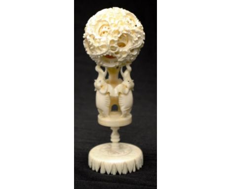 Chinese ivory puzzle ball on stand circa 1930 the multi layer dragon decorated ball supported by a pedestal base with 3 eleph