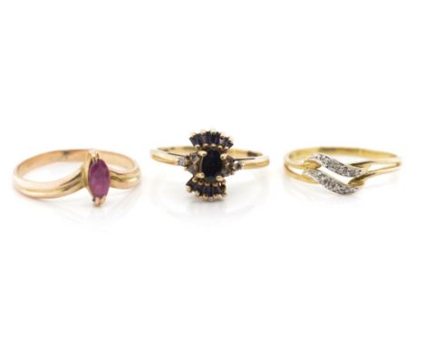 Three gemstone set 9ct yellow gold rings includes a sapphire and diamond cluster, and a a ruby example. Approx weight 5 grams