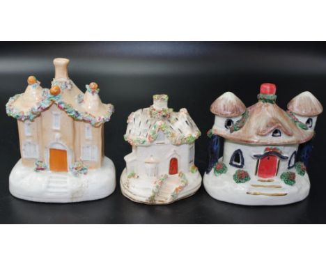Three various antique ceramic pastille burners including cottage form, (restoration to base), and 2 various castle form.