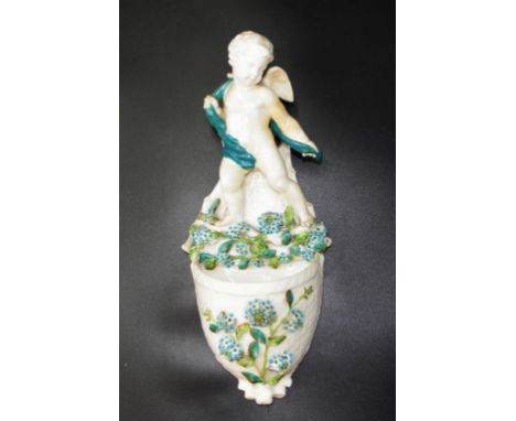 Antique Moore Brothers ceramic wall pocket standing Putti figure atop applied floral decorated bowl, (height 30cm approx).