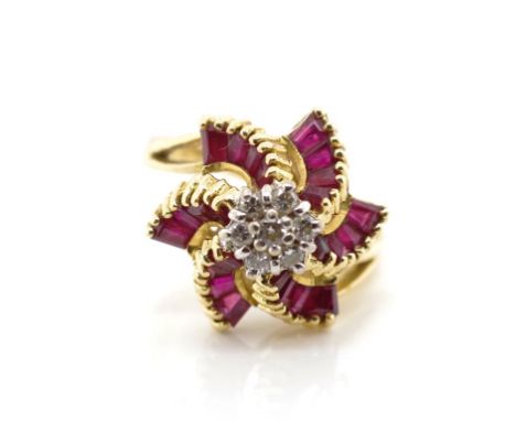 Ruby and diamond set 18ct yellow gold ring with round brilliant cut diamonds and tapered ruby baguettes set in a raise star m