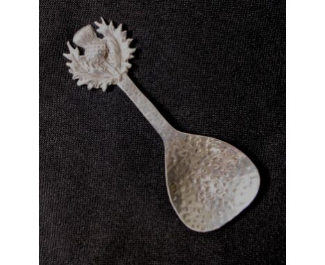 Scottish Arts &amp; Crafts sterling silver caddy spoon hallmarked for Glasgow 1935, maker's mark rubbed, hand beaten decorati