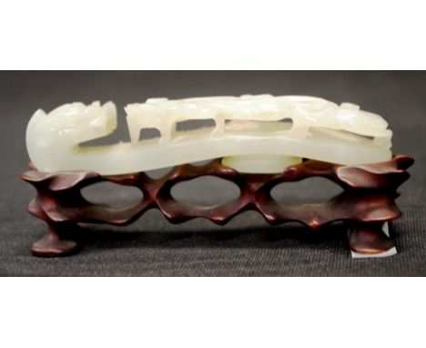 Good Chinese jade dragon head buckle/belt  hook on a carved timber stand, width 10.5cm approx