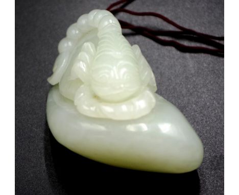 Chinese carved jade scorpion figure a figure of a Scorpion on a Rock, (length 7cm approx).