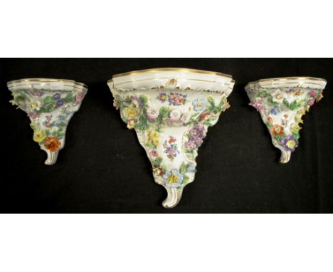 Three Dresden decorative porcelain wall brackets applied floral decoration, including 1 larger bracket,  (height 21cm approx)