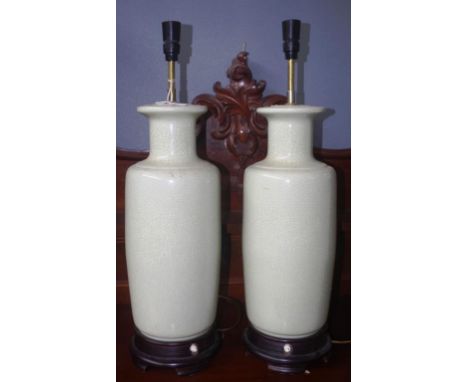 Pair Chinese ceramic electric table lamps crackle glaze ceramic bases, each with carved wood base, (height 51cm approx, each 