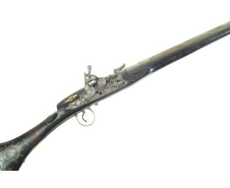 Persian Kabyle Snaphaunce long gun, with 44 inch 32 bore barrel, inlaid with white metal wire, ivory butt.Section 58(2) Antiq