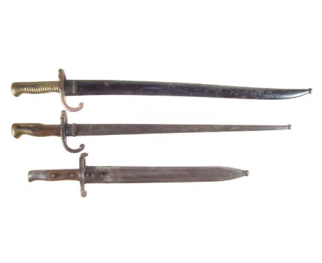 Three bayonets and scabbards, to include a Steyr 1886 bayonet and scabbard (blade reduced in length) also an 1866 Chassepot b