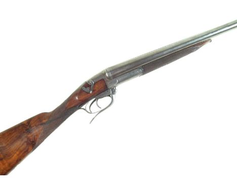 Gibbs 12 bore side by side hammerless shotgun, serial number B707, with 30 inch Damascus nitro proofed barrels choked to 1/4 