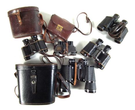 Five pairs of binoculars, to include a pair of broad arrow marked Bino Prism No.2 MK3, also a pair of Leitz 6x30, a pair of K
