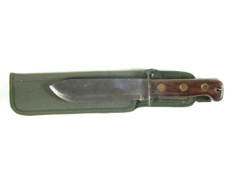 British Army survival knife, in canvas scabbard, the grip marked with broad arrow and 82.31cm long 