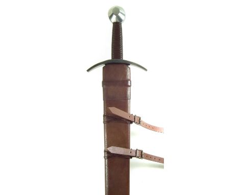 Modern replica of a Crusader's broadsword and leather scabbard, after a 13th century original.94cm long 