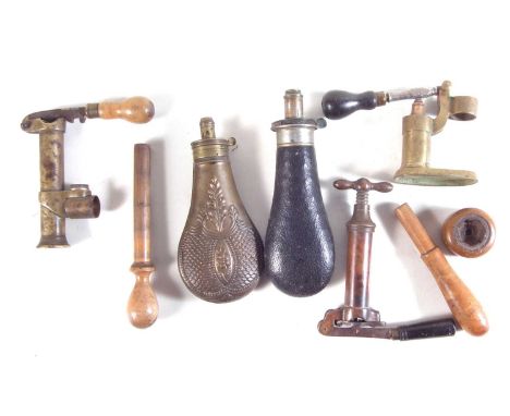 Vintage shotgun reloading tools, to include a Cocker patent 12 bore tool and two capper / de-capper tools with a hardwood ram