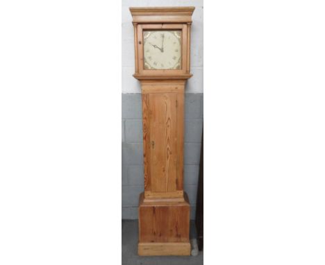 A longcase clock with a painted face, in a pine case