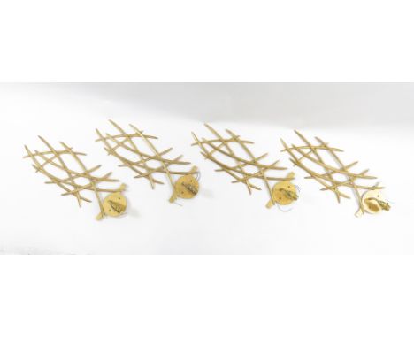 Four gilt metal wall light fittings in the form crossing blades of grass, with three associated shades