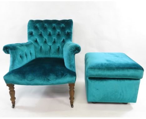 A button back armchair upholstered in velvet teal fabric, with matching square footstool