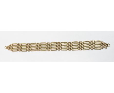 A 9 carat gold bracelet, of six bar gate link design, 9.7 g gross