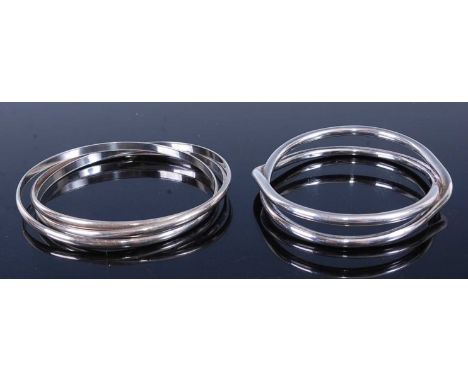 A modern silver Russian style bangle, together with one other modern silver heavy bangle, gross weight 78g (2)