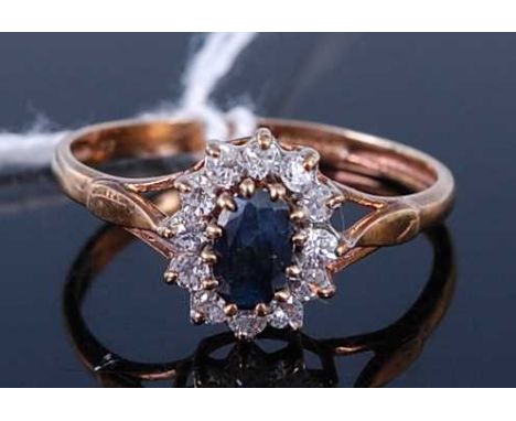 A 9ct gold blue sapphire and CZ set cluster ring, size Q, 1.9g
