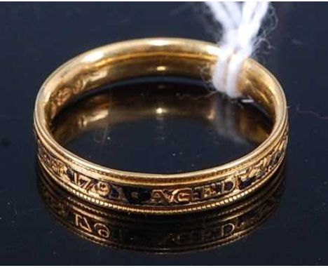 A William IV yellow metal and black enamel mourning ring assayed for London 1831, size P, 4.1g
