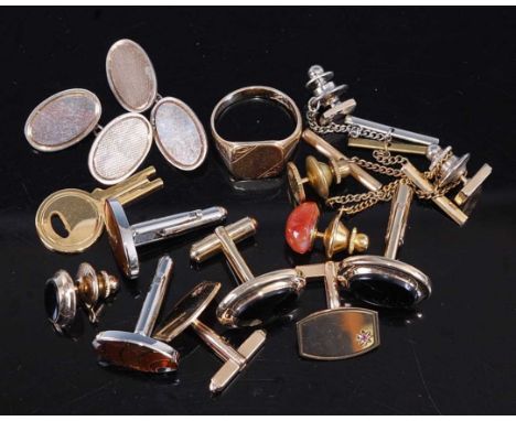 A pair of gent's 9ct gold cufflinks, each 'gypsy' set with a small ruby; together with a gent's 9ct gold signet ring, gross w