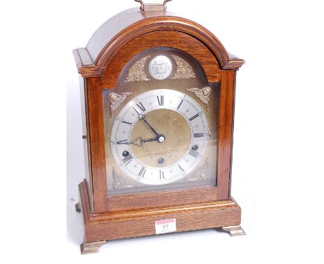 A 20th century mahogany cased bracket clock, in the Georgian style, the eight-day movement with chimes, the silvered chapter 