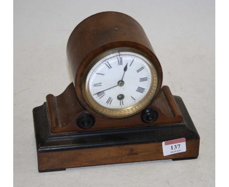A Victorian walnut cased mantel clock, the enamel dial showing Roman numerals 18cm high
