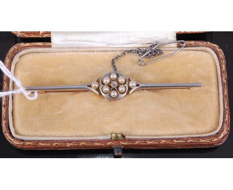 A 15ct gold and platinum faced bar brooch, set with six seed pearls and a central small diamond, 4.5g, 6cm, in original fitte