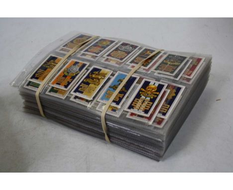 A large collection of assorted cigarette cards, to include Gallagher Ltd Army Badges, Famous Film Scenes etc; together with v