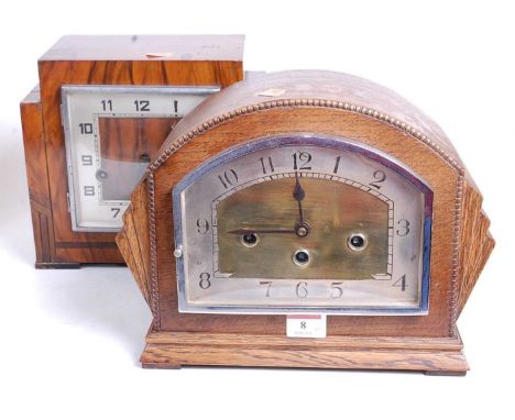 A 1930s oak cased mantel clock, the eight day movement with chimes, the silvered chapter ring showing Arabic numerals, the ca