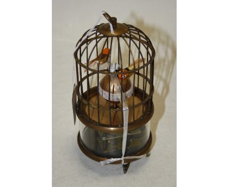 A reproduction singing bird in cage clockwork automaton, height 18cmCondition report: Clockwork does not tick for long.